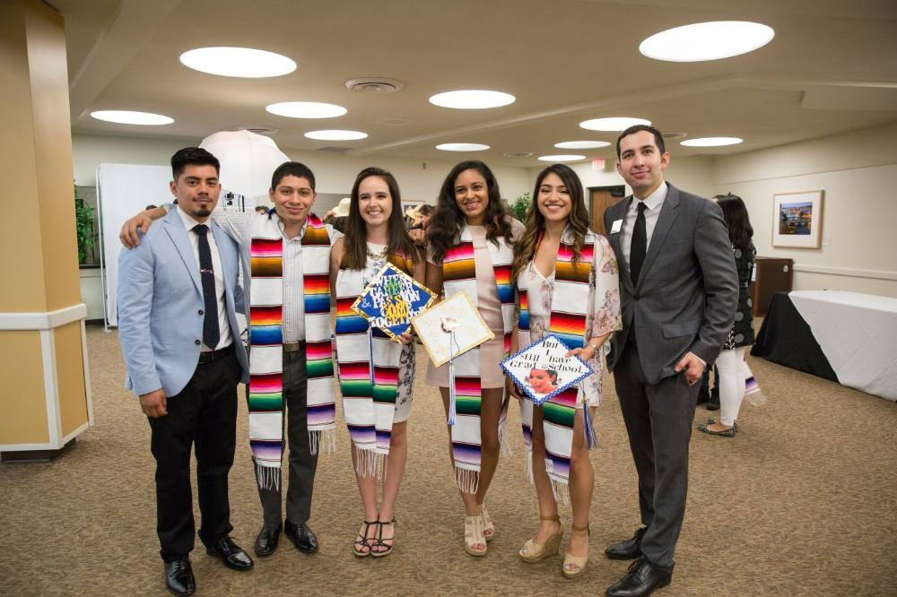 A small group of Latino graduates